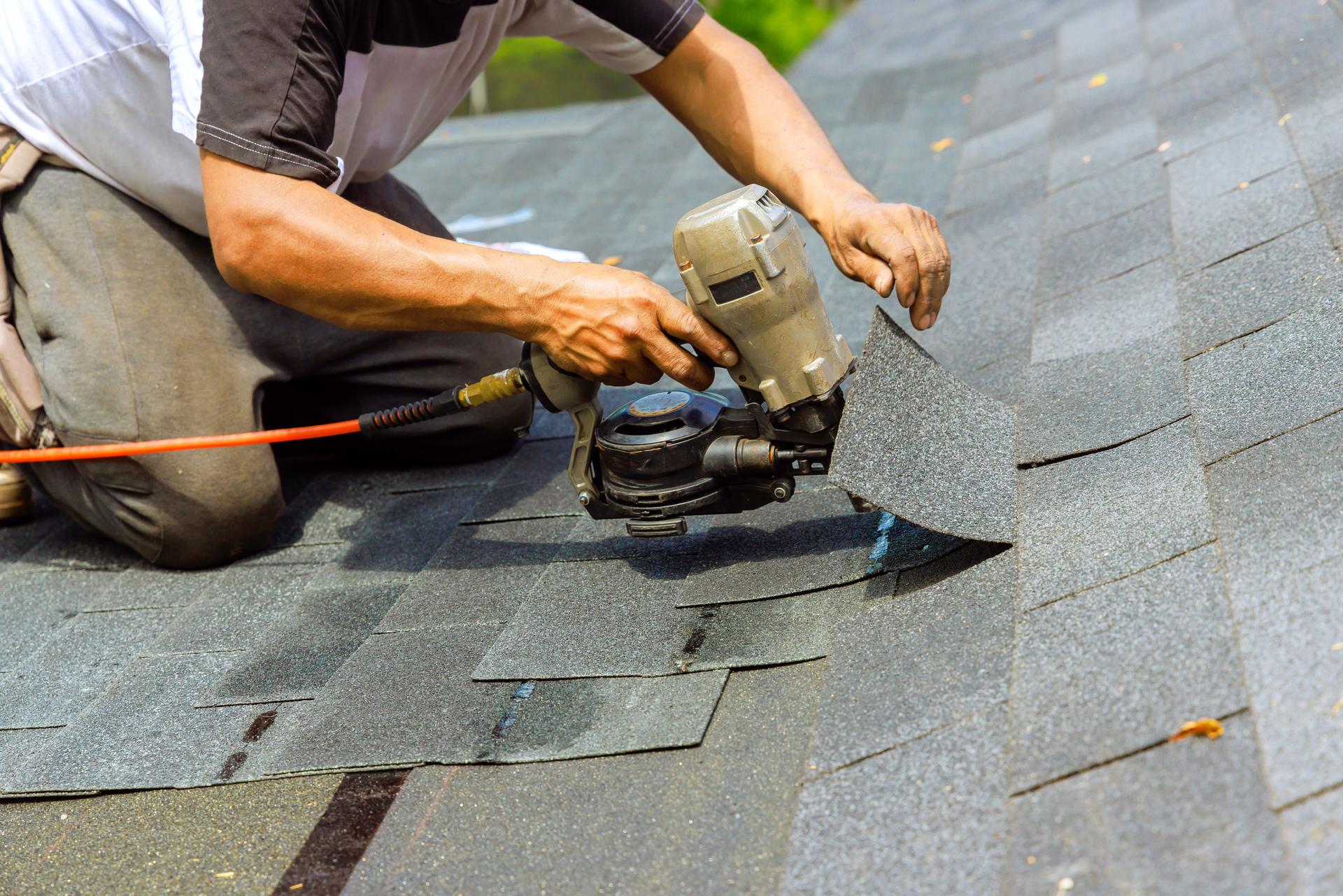 york pa During installation of new bitumen shingles, construction roofer used a pneumatic air nail gun